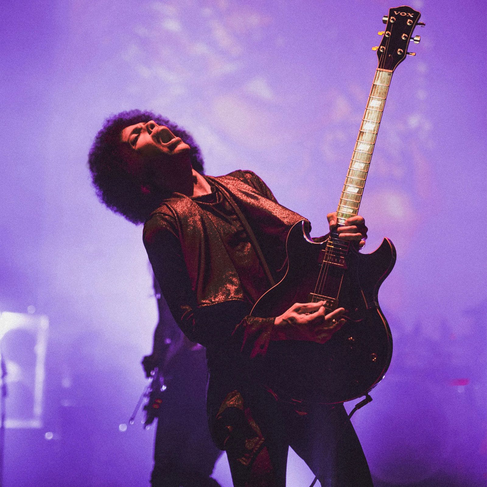 Prince performing with guitar