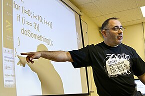 Golan Levin lecturing using a projected side